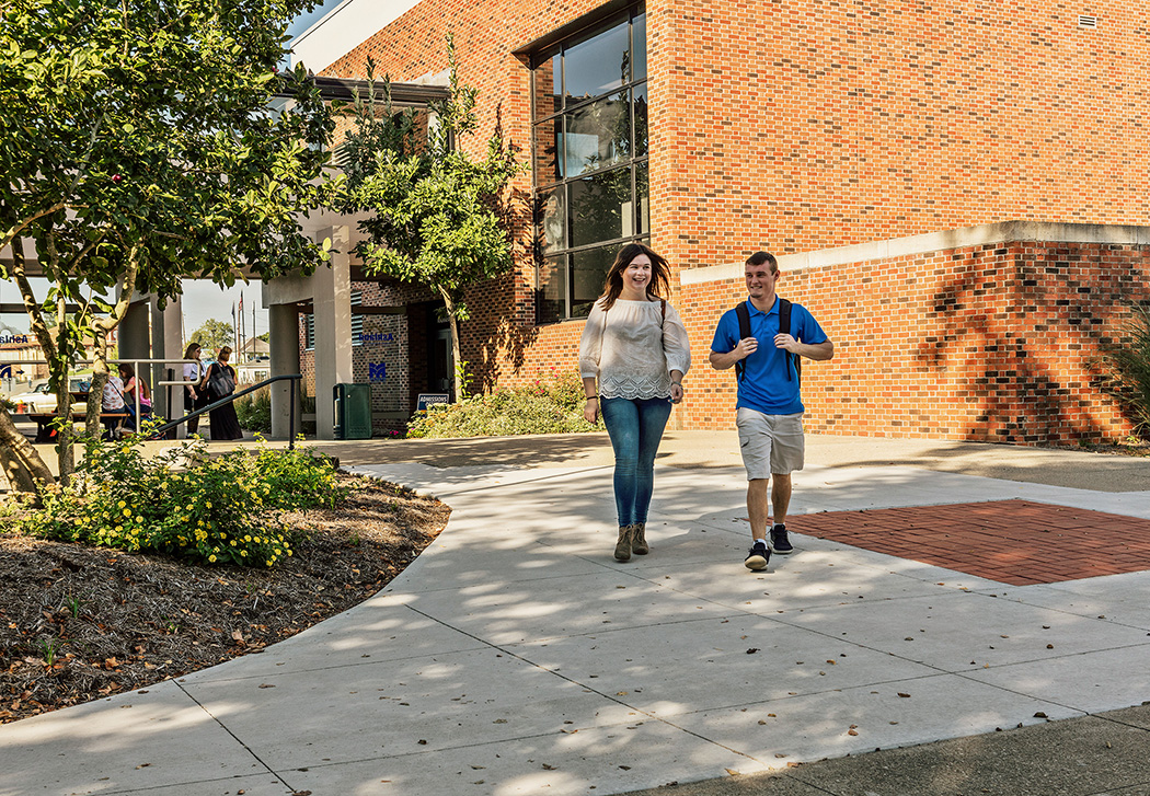 group of students talking and laughing